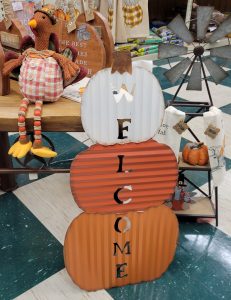 Orange and White Metal Pumpkins that say "Welcome"