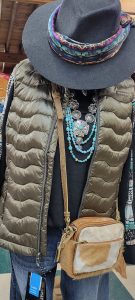 New Fall Arrival: Ladies black shirt with puffy vest, turquoise necklace, black hat and cross body tan purse