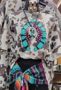Super cool cow print shirt with blue and pink design on the front, aztec jacket and matching necklace
